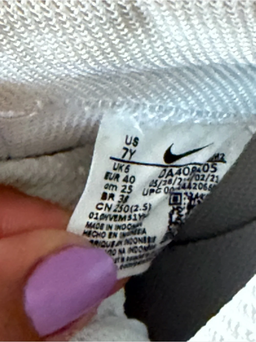 Nike Women’s White High-Top Sneakers with Pink Swoosh Accent